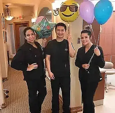 Patient celebrating with the team after treatment