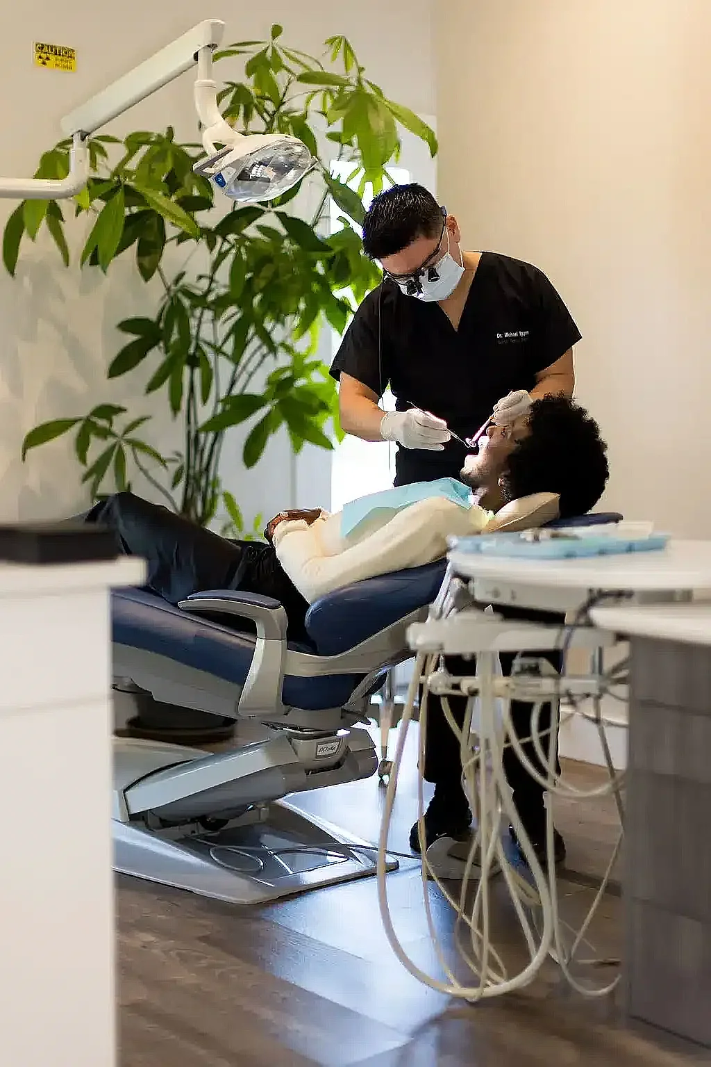 Dentist treating a patient in a Precision Dental Care operatory