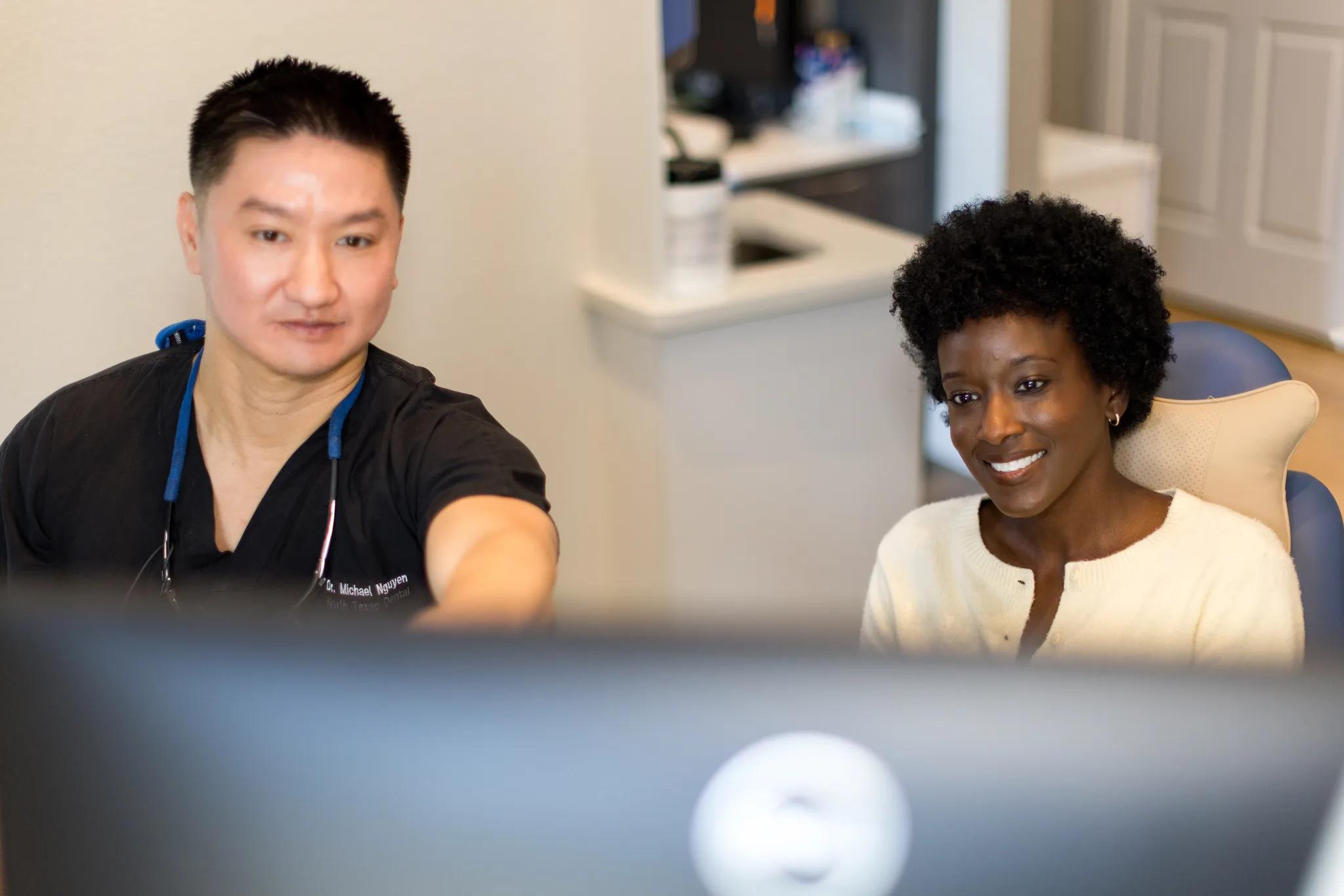 Dr. Nguyen talking a patient through her imaging on screen