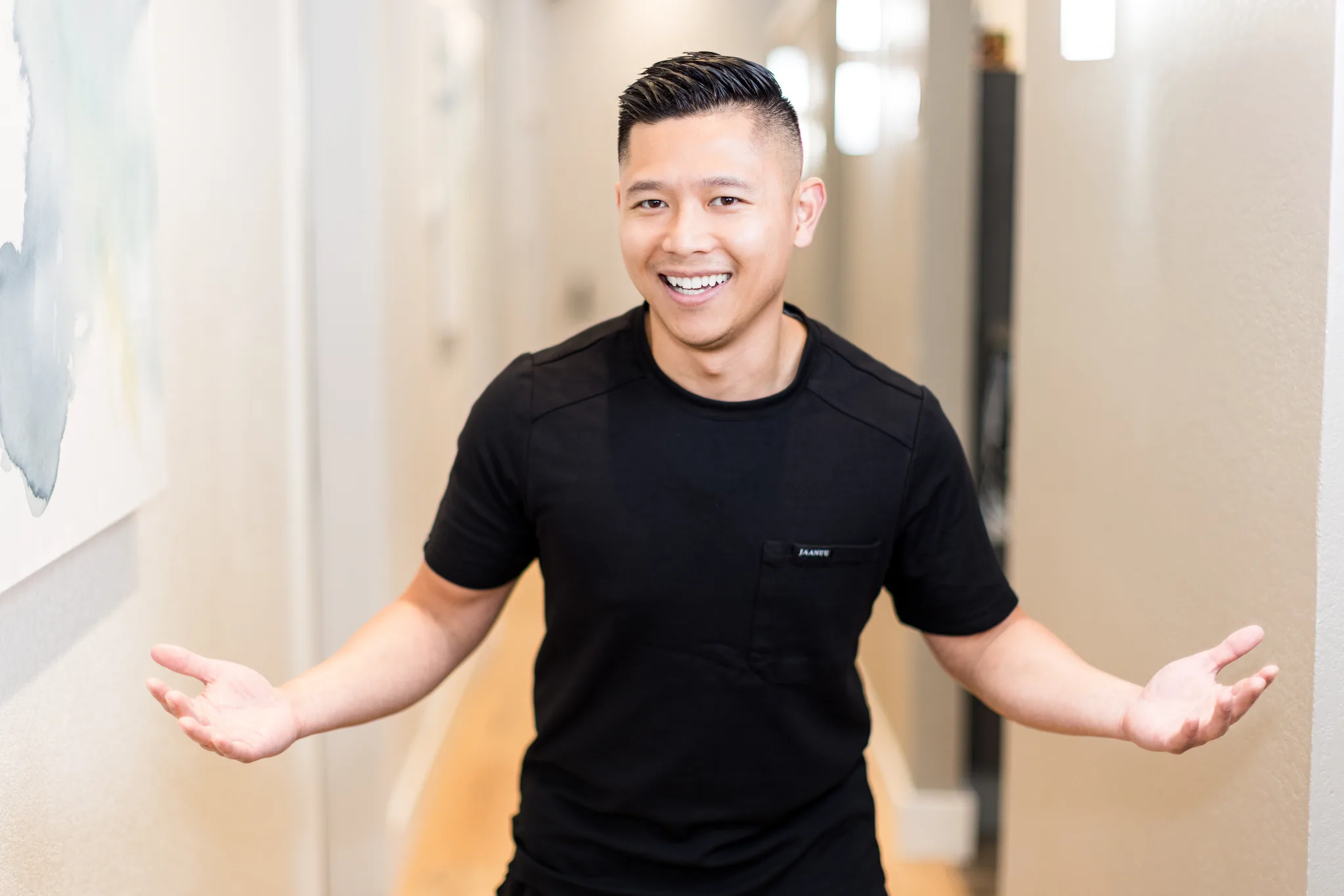 Dr. Michael Nguyen in the practice hallway at Precision Dental Care