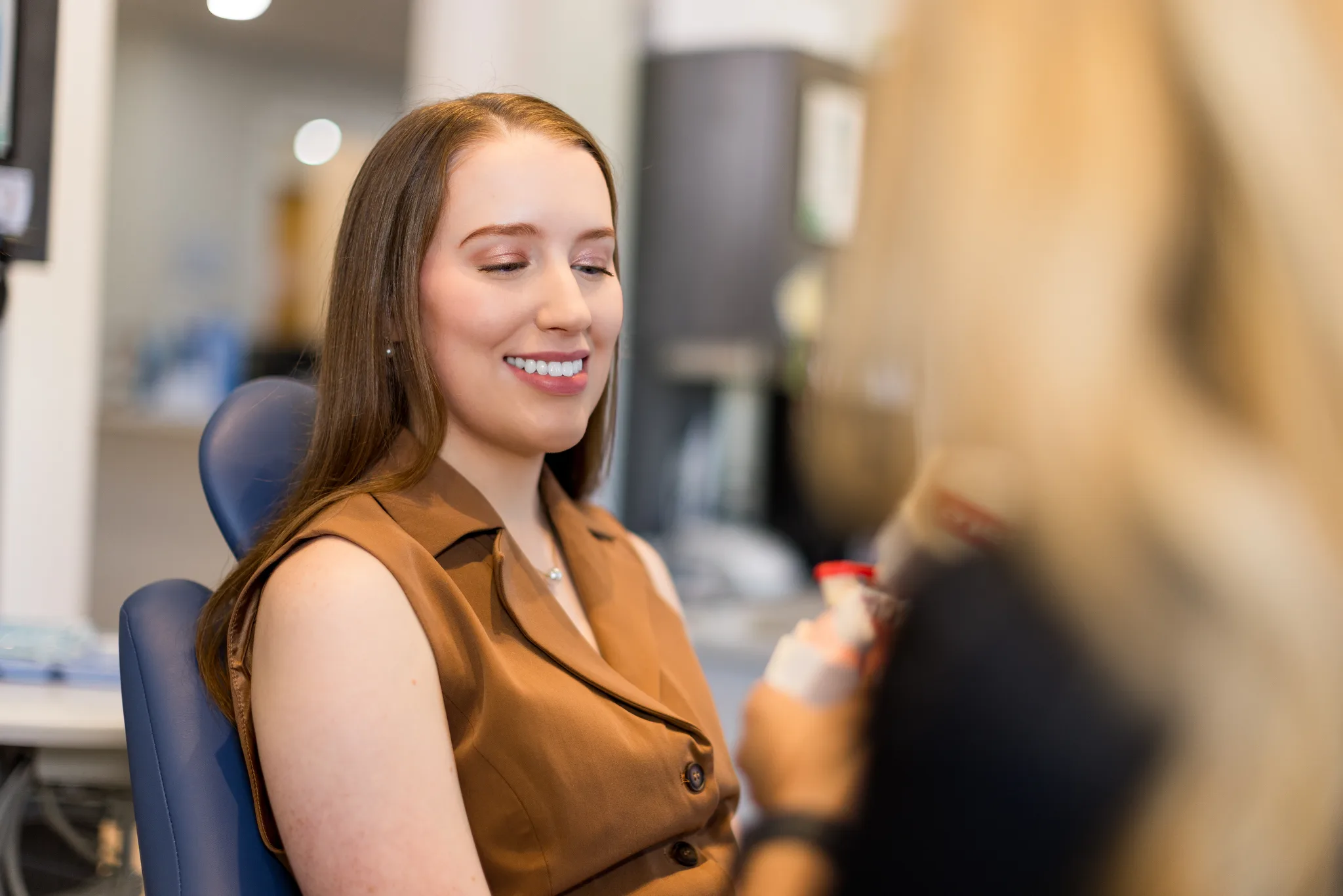 A patient smiling during a routine hygiene visit