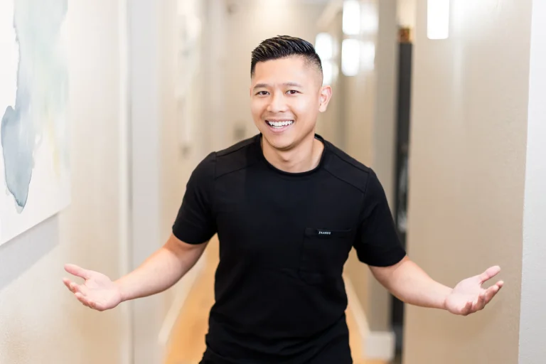 Dr. Michael Nguyen in the practice hallway at Precision Dental Care