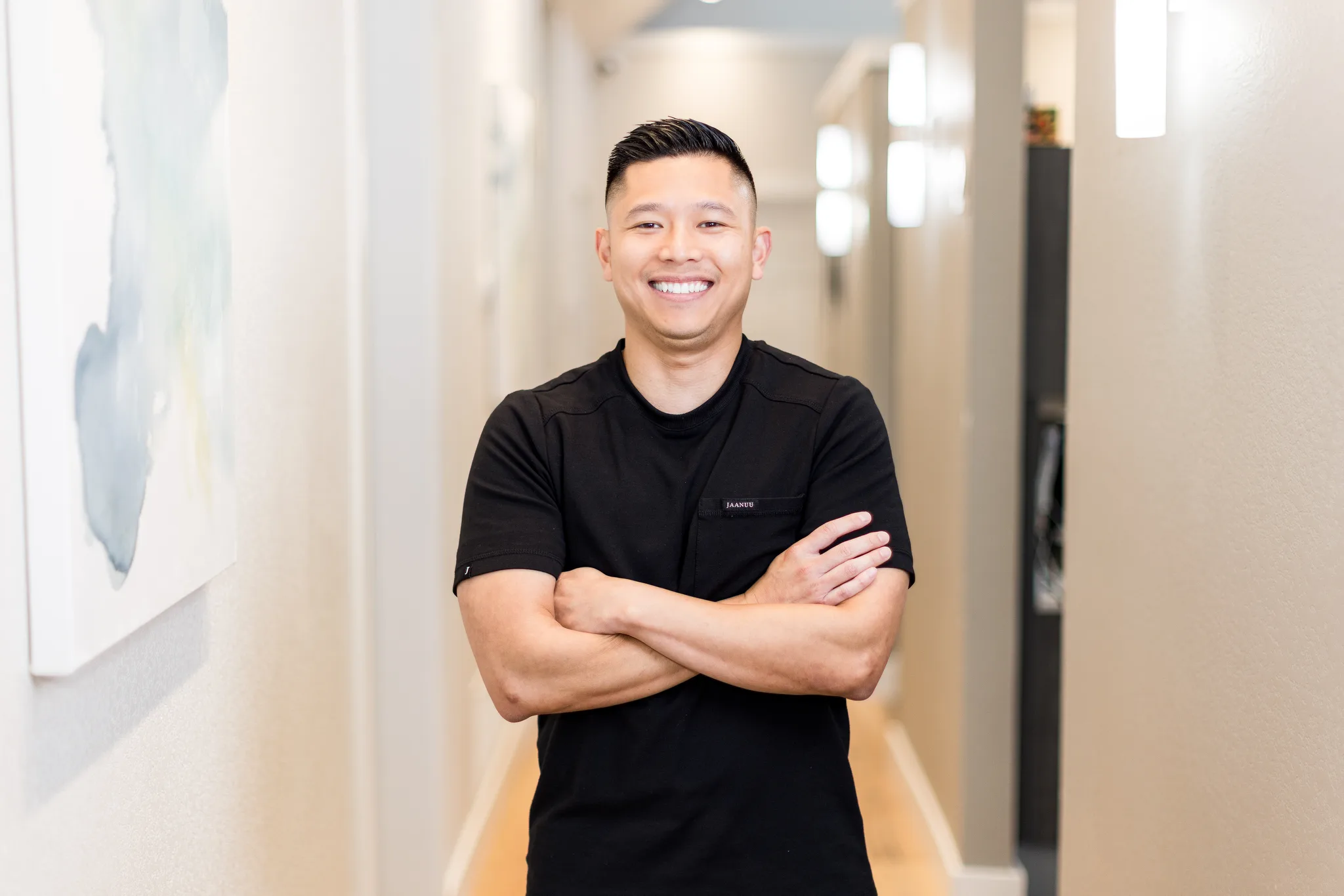 Dr. Michael Nguyen in the practice hallway at Precision Dental Care