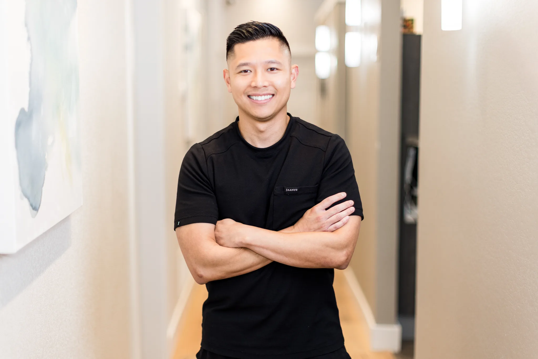 Dr. Michael Nguyen in the practice hallway at Precision Dental Care