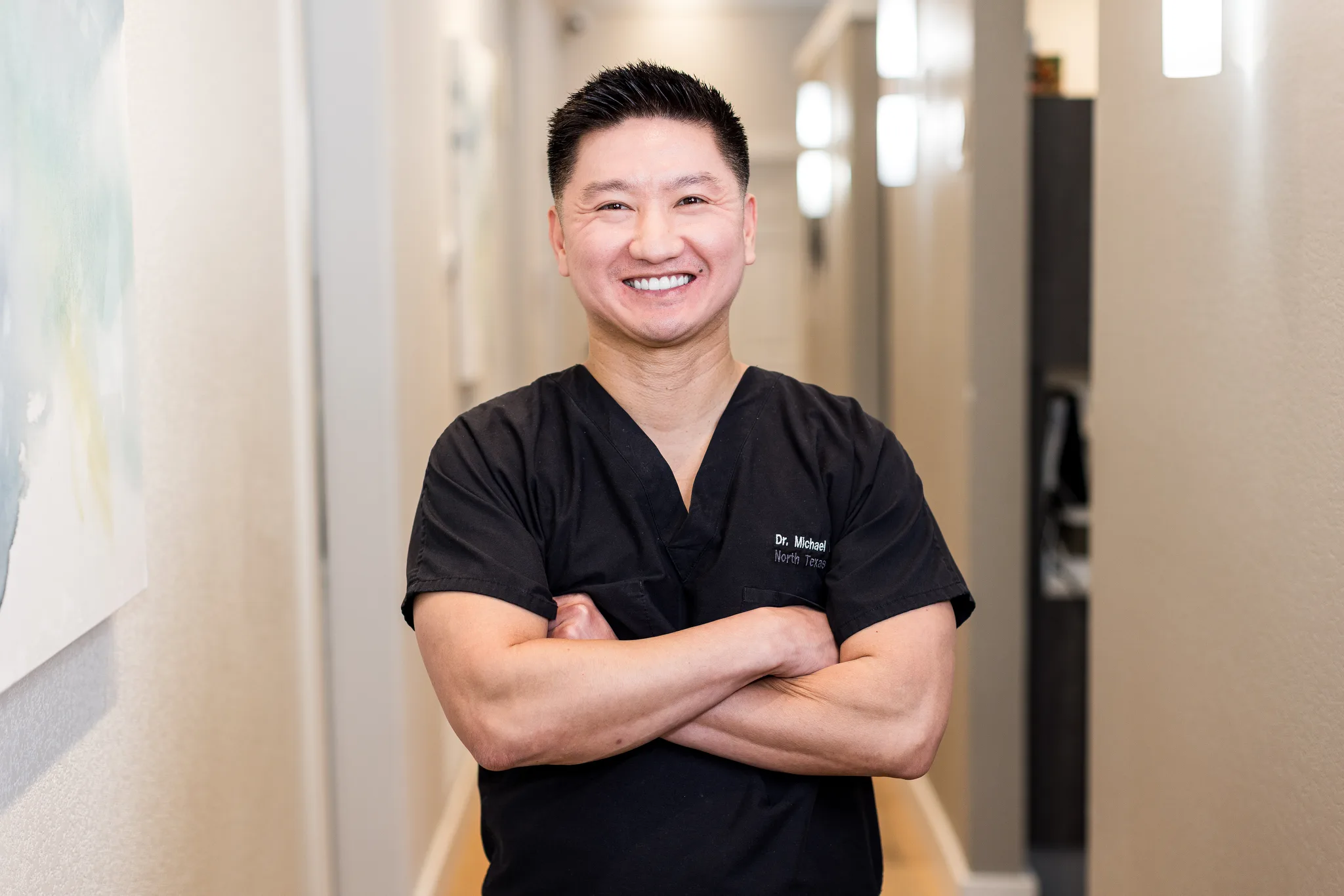 Dr. Michael Nguyen in the practice hallway at Precision Dental Care
