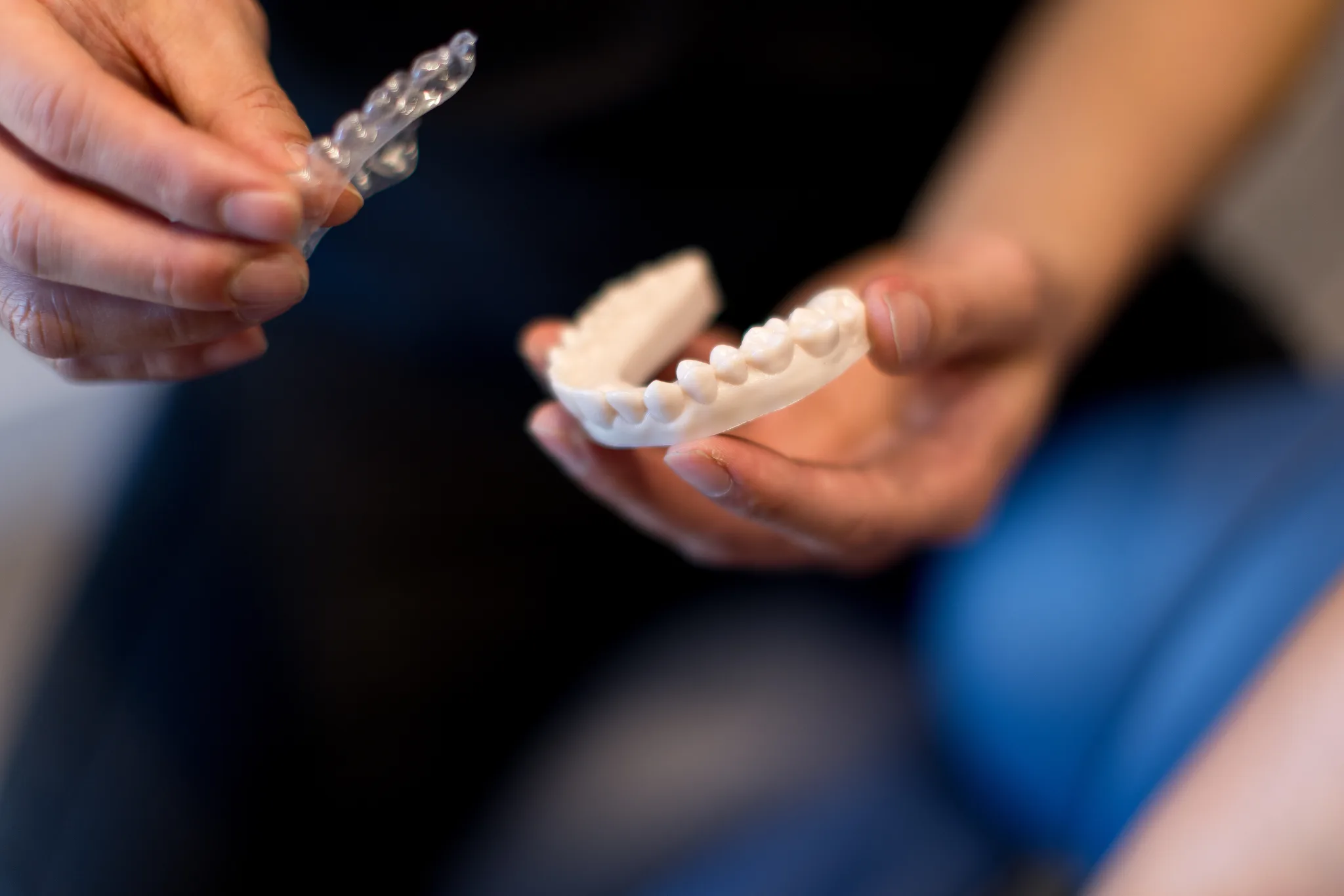 Clear aligner tray fitted over a printed dental model