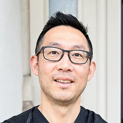 Dr. Bobby Kwon in glasses and dark scrubs